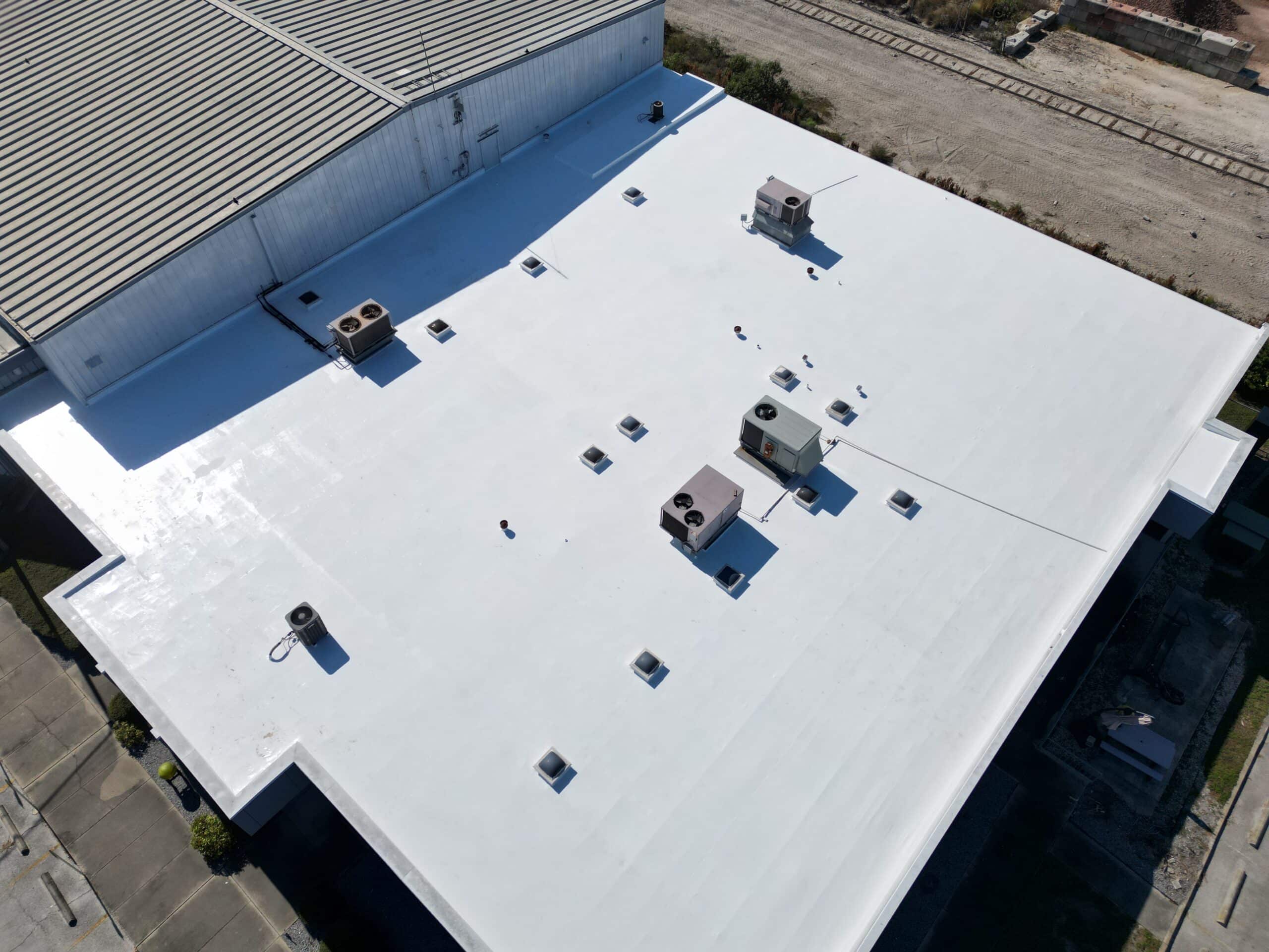 Completed coated commercial TPO roof viewed from above